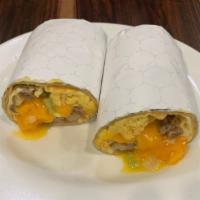 Breakfast Burrito · Scrambled eggs mixed with crumbled sausage, peppers, onions, cheddar cheese and topped with ...
