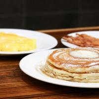 Hearty Breakfast · Pancakes or French toast or Waffle with eggs, bacon or ham or sausage. Served with butter an...