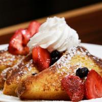 Fruity Explosion · Choice of Pancakes, Waffle or French Toast topped with fresh strawberries ,fresh blueberries...