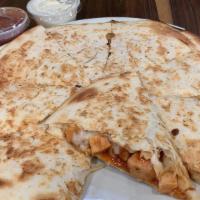 Chicken Quesadilla · Flour tortilla filled with chicken and a blend of mozzarella and cheddar cheeses. Served wit...