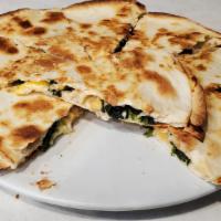 Spinach Quesadilla · Flour tortilla filled with spinach and a blend of mozzarella and cheddar cheeses. Served wit...