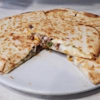 Mexican Quesadilla With Steak · Green peppers, onions, tomato, jalapeno, jack and cheddar cheeses. Served with sour cream an...