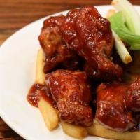 Buffalo Wings · 6 pc. spicy chicken wings smothered with buffalo sauce served with celery sticks & Blue Chee...