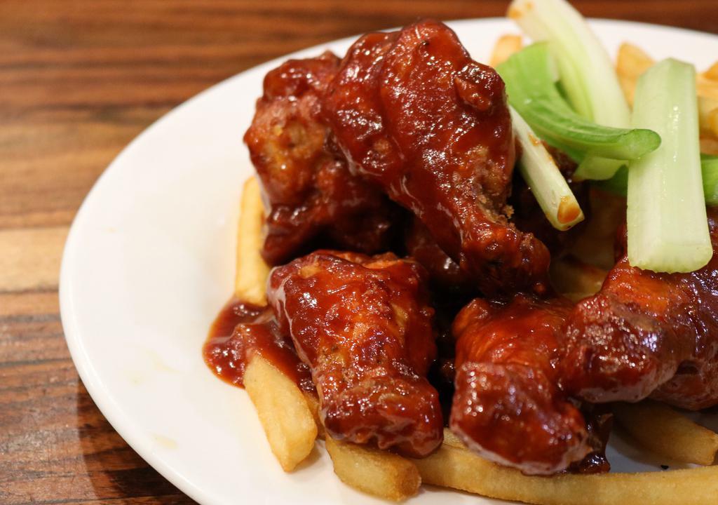 Buffalo Wings · 6 pc. spicy chicken wings smothered with buffalo sauce served with celery sticks & Blue Cheese dressing.