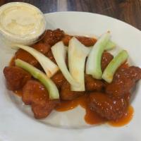Boneless Wings · Hot and tender boneless chicken chunks smothered with buffalo sauce.