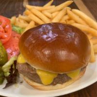 Ssd Cheeseburger Deluxe · Brioche bun topped with American cheese, lettuce and tomato, ketchup & french fries. Served ...