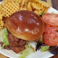 California Burger Deluxe · Brioche bun topped with crispy bacon, pepper jack cheese, avocado, lettuce, tomato, and ketc...