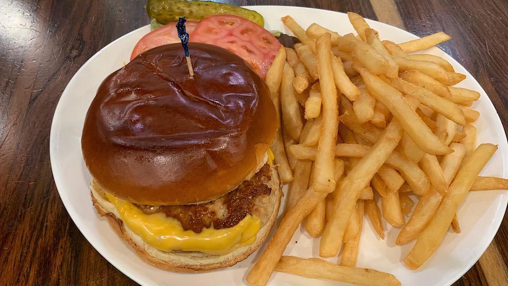 Turkey Burger Deluxe · Brioche bun topped with American cheese, lettuce, tomato, and ketchup. Served with french fries and pickle.