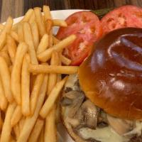 Mushroom & Swiss Burger Deluxe · Brioche bun topped with sauteed mushrooms, melted Swiss, lettuce, tomato, and ketchup. Serve...