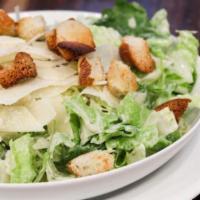Grilled Chicken Caesar Salad · Topped with grilled chicken and served with a hot pita.