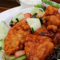 Buffalo Chicken Salad · Tossed salad mixed with blue cheese dressing topped boneless buffalo chicken chunks and serv...