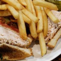 Turkey Triple Decker · Turkey, bacon, lettuce, tomato, and mayo on toast. Served with fries.