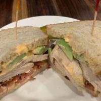 Roast Turkey A.T.B. Sandwich · Roast turkey with avocado, tomato, and bacon topped with chipotle mayo on rye bread.