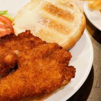 Chicken Sandwich · Crispy breaded all white meat chicken with lettuce, tomato, and mayo, served on an on a brio...
