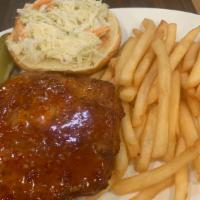 Tai Chili Chicken Sandwich · Crispy white meat cutlet tossed in a spicy sweet glaze topped with slaw on a brioche bun.