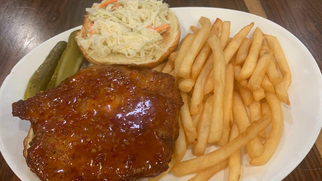 Tai Chili Chicken Sandwich · Crispy white meat cutlet tossed in a spicy sweet glaze topped with slaw on a brioche bun.