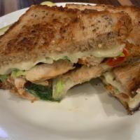 Florence Panini · Grilled chicken topped with roasted sweet peppers, melted Mozzarella, pesto mayo, and greens...