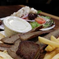 Gyro Sandwich · Combination of beef and lamb sliced and served on a pita with lettuce, tomato, onions and wh...