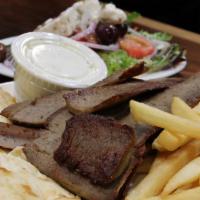 Gyro Dinner · Gyro meat served with a Greek salad, fries and pita bread.