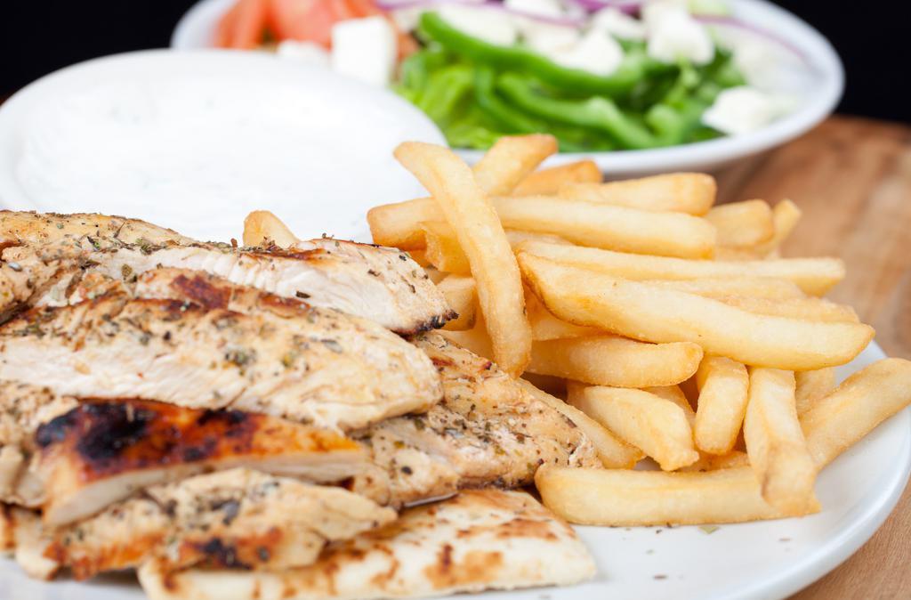 Chicken Souvlaki Dinner · Pieces of marinated grilled chicken on a hot pita, topped with sauce and served with Greek salad and fries.