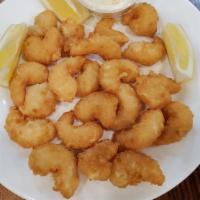 Lots Of Shrimp · Fried shrimp served with tartar sauce.