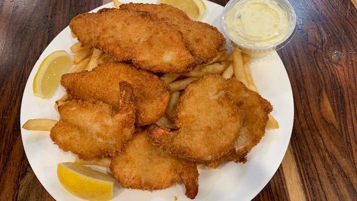 Crispy Shrimp & Chips · 6 pieces. of butterfly shrimp, served with fries and coleslaw, lemon and tartar sauce.