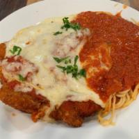 Chicken Parmigiana · Tender breaded chicken breasts topped with marinara sauce served with spaghetti and topped w...