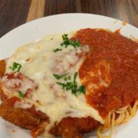 Eggplant Parmigiana · Lightly fried eggplant cutlets topped with marinara sauce. Served with spaghetti and topped ...