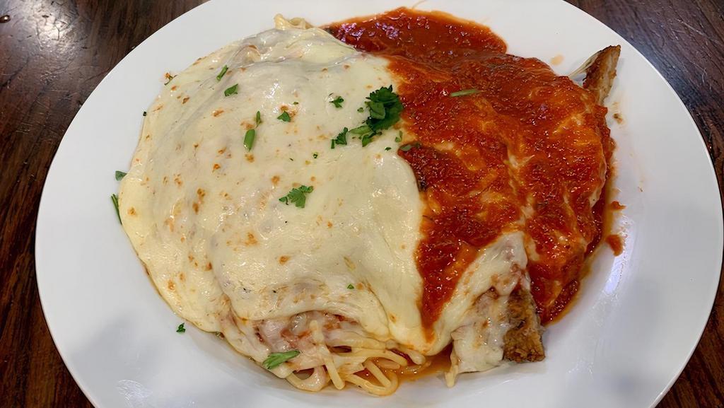 Veal Parmigiana · Breaded veal cutlets topped with marinara sauce. Served with spaghetti and topped with mozzarella. Baked to golden brown perfection.