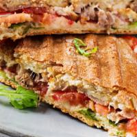 Chicken Panini · Chicken, crispy bacon, portobello mushrooms, mayonnaise, and melty cheese in a hot, grilled ...