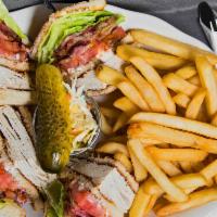Roast Turkey Club · Prepared on three slices of bread with bacon, lettuce, tomato, and mayonnaise. Served with F...
