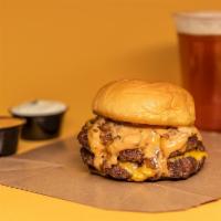 Just The Cheese Burger · Seared Pat LaFriedapatty topped with melted American cheese, frenched onion, and our signatu...