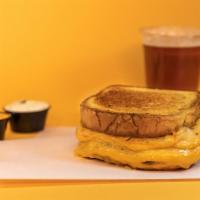 Classic Grilled Cheese · American cheese grilled with a buttered potato bun.