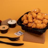 Sea Salt Tots · Crispy tater tots seasoned with sea salt and freshly ground black pepper.