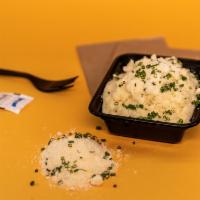Parmesan Mashed Potatoes · Creamy and velvety idaho mashed potatoes with freshly grated parmesan cheese and chives.