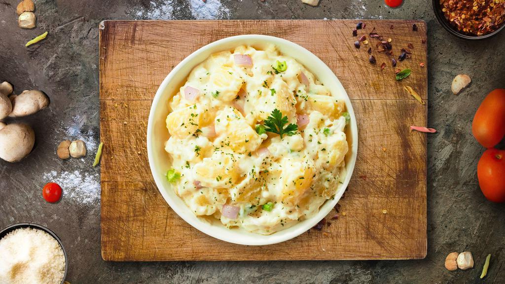 Mashy Mashy Potato · Mashed Idaho potatoes cooked, seasoned with garlic, butter, and topped with crispy bits of bacon.