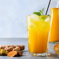Turmeric Sunrise Juice · Fresh juice made with ginger, turmeric, carrot, orange, lemon and lime.