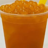 Passion Fruit Iced Tea · Popping pearls, daily brewed organic tea, ice, syrup.