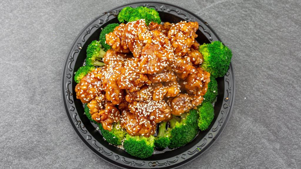 Sesame Chicken · Tender chunky chicken meat, marinate, and fried till crispy, served with sesame sauce. With white rice.
