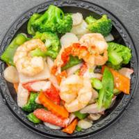 Seafood Delight · Jumbo shrimp, lobster, fresh scallops & crab meat w. snow peas, mushroom, broccoli in specia...