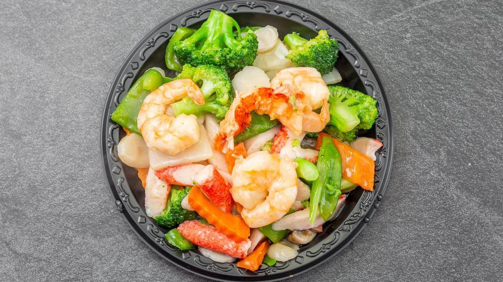 Seafood Combo · Scallop, shrimp and crabmeat stick with vegetable in a delicious white sauce.