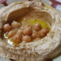 Hummus With Pita · Chickpeas dip with tahini, garlic and juiced lemon.