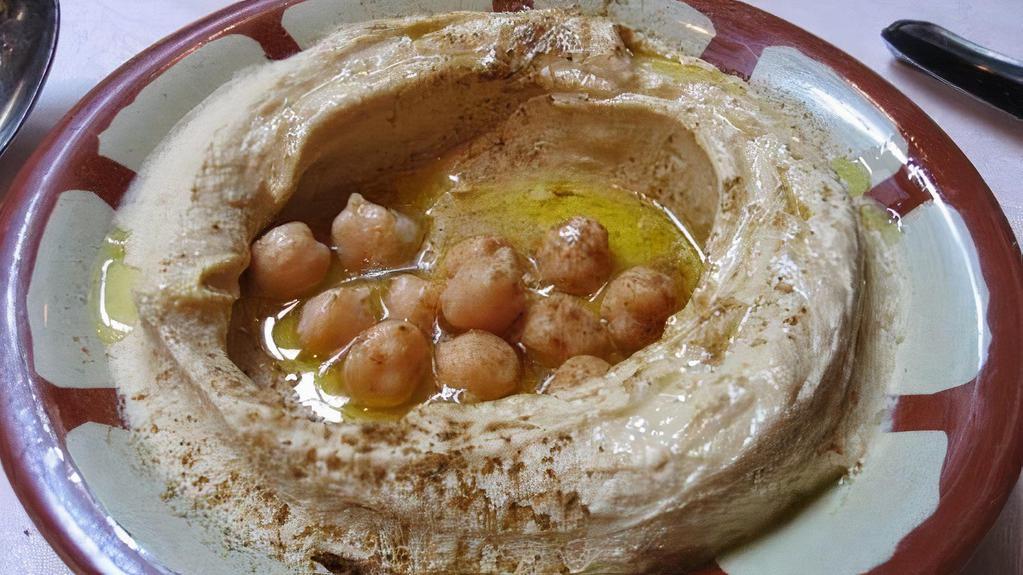 Hummus With Pita · Chickpeas dip with tahini, garlic and juiced lemon.
