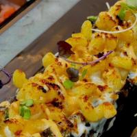 Mac Con Queso · A flavorful, creamy mac and cheese combined with fried sweet plantains for a sweet and savor...