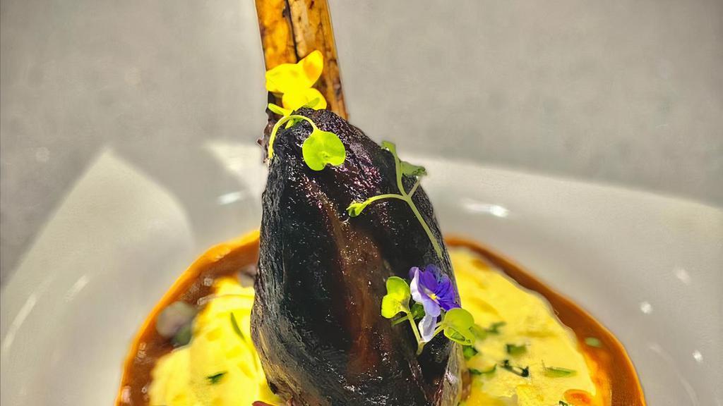 Braised Lamb Shank · 4 hour braised lamb shank served with a creamy cassava purée paired with a red wine reduction sauce.