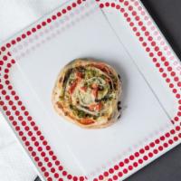 Vegetable Pinwheels · Sauteed broccoli and spinach with fresh tomatoes and mozzarella cheese