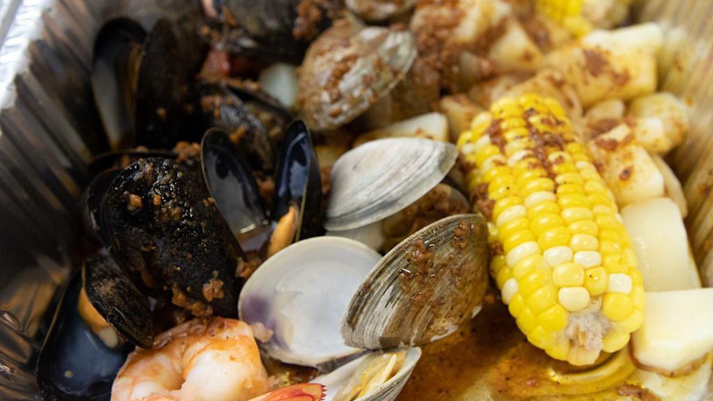 Mussels, Clams Shrimp, Potato & Corn Bag · comes with potatoes corn & Cajun  sauce