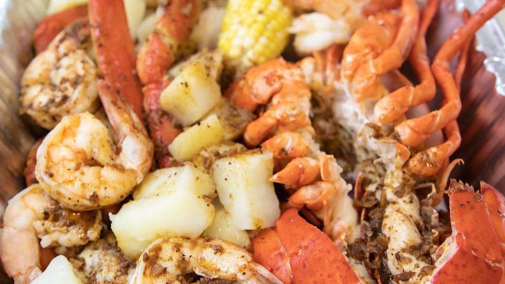 Harbour House Special · Whole lobster, snow crab legs and shrimp.
 Served with comes with potatoes corn & Cajun  sauce