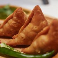 Veggie Masala Samosa · Vegan, vegetarian. (spiced potato and peas triangle pastry)