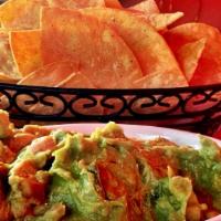 Fresh Made Guacamole · Served with corn tortilla chips.